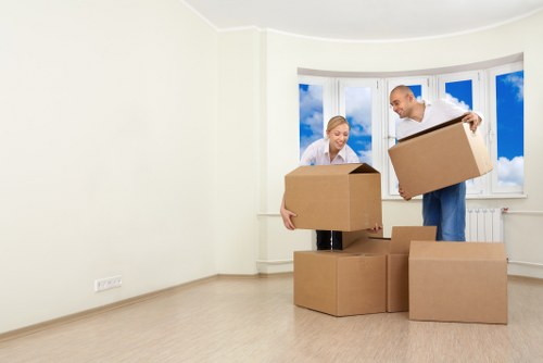 Moving boxes and furniture being carried from a central London flat