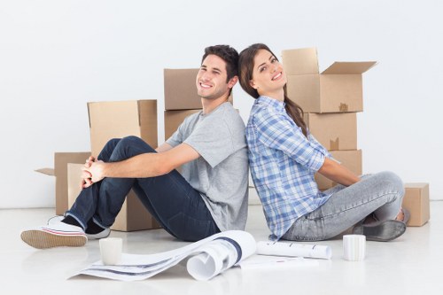 Professional team preparing fragile household items for transport