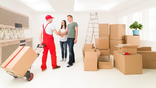 Unloading boxes and furniture into a Knightsbridge apartment during a home move