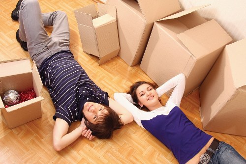Staff using safe lifting techniques during a move