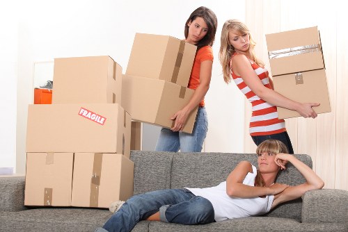 Professional movers handling furniture in a Knightsbridge residential building